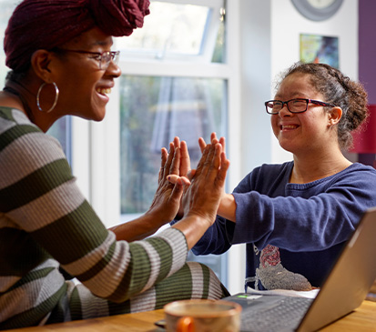 two individuals engaged in a crafting activity demonstrating teamwork and creativity in a studio setting exploring twelve unique techniques