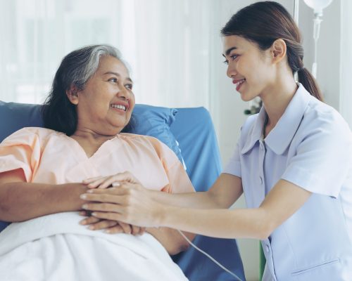 the nurses are well good taken care of elderly woman patients in hospital bed patients  feel happiness - medical and healthcare concept